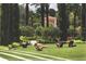 Fitness class on the lawn; beautiful landscaping, lush greenery and sunshine at 10160 Autumn Mist Ln # 601, Golden Oak, FL 32836