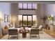 Bright living room with high ceilings and ample natural light from the sliding glass doors to the balcony at 10160 Autumn Mist Ln # 601, Golden Oak, FL 32836