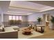 Upstairs sitting area boasts a comfortable couch and chairs to enjoy the view from the large windows at 10160 Autumn Mist Ln # 601, Golden Oak, FL 32836