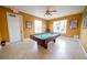 Bright game room featuring a well-maintained pool table and natural light at 1053 Tourmaline Dr, Kissimmee, FL 34746