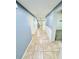 Inviting hallway with neutral tile flooring and fresh paint, leading to various rooms at 1053 Tourmaline Dr, Kissimmee, FL 34746