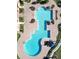 Aerial view of a large community pool with unique design and surrounding lounge area at 1053 Tourmaline Dr, Kissimmee, FL 34746