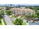 Aerial view of a luxurious condominium building with manicured landscaping and a grand entrance at 1110 W Ivanhoe Blvd # 15, Orlando, FL 32804
