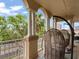 Cozy balcony with hanging chairs, offering views of the cityscape and lush greenery at 1110 W Ivanhoe Blvd # 15, Orlando, FL 32804