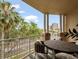 Relaxing balcony with table and chairs, showcasing cityscape views and natural light at 1110 W Ivanhoe Blvd # 15, Orlando, FL 32804