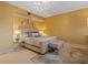 Bedroom featuring an ornate light fixture, soft rug, upholstered bed and yellow walls at 1110 W Ivanhoe Blvd # 15, Orlando, FL 32804
