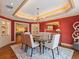 Formal dining room with glass table, display cabinets, and elegant chandelier is perfect for entertaining at 1110 W Ivanhoe Blvd # 15, Orlando, FL 32804
