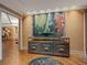 Elegant foyer with textured wallpaper, modern art, and hardwood floors exudes sophistication at 1110 W Ivanhoe Blvd # 15, Orlando, FL 32804