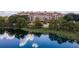 Luxury lakeside condo building with lush landscaping and serene water views offers resort-style living at 1110 W Ivanhoe Blvd # 15, Orlando, FL 32804