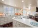 Sunlit kitchen with white cabinetry, large windows, and open layout perfect for modern living and entertaining at 1110 W Ivanhoe Blvd # 15, Orlando, FL 32804