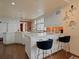 Well-appointed kitchen features white cabinets, island seating, and modern appliances for cooking enjoyment at 1110 W Ivanhoe Blvd # 15, Orlando, FL 32804
