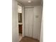 Hallway view of bathroom featuring folding door with sink, mirror, and lighting at 11574 Westwood Blvd # 1126, Orlando, FL 32821