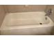 Simple white bathtub with a chrome faucet and shower head set against tiled walls for a clean look at 11574 Westwood Blvd # 1126, Orlando, FL 32821