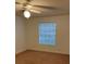 Bedroom featuring neutral paint, carpet flooring, a ceiling fan, and a window at 11574 Westwood Blvd # 1126, Orlando, FL 32821