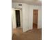 Bedroom with two doorways, one to bathroom, one to closet, all with neutral walls and carpet at 11574 Westwood Blvd # 1126, Orlando, FL 32821