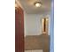 Inviting entryway with neutral walls, carpet, and glimpse of the kitchen at 11574 Westwood Blvd # 1126, Orlando, FL 32821