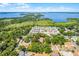 An aerial view highlights the homes' prime location near a large lake and surrounding community at 1210 S Clayton St, Mount Dora, FL 32757