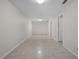 Spacious basement with tile flooring and recessed lighting provides functional storage space at 1210 S Clayton St, Mount Dora, FL 32757