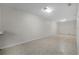 Spacious basement with tile flooring and recessed lighting provides functional storage space at 1210 S Clayton St, Mount Dora, FL 32757