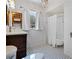 Updated bathroom featuring a clawfoot tub, classic tiles, and stylish decor at 1210 S Clayton St, Mount Dora, FL 32757