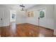 Charming dining area boasting hardwood floors, wainscoting, and a modern light fixture, perfect for Gathering meals at 1210 S Clayton St, Mount Dora, FL 32757