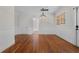 Lovely dining room with gleaming hardwood floors, wainscoting, and access to the backyard at 1210 S Clayton St, Mount Dora, FL 32757
