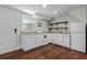 Kitchenette featuring white cabinetry and modern appliances at 1210 S Clayton St, Mount Dora, FL 32757
