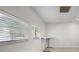 Bright office features natural light, and a compact standing desk at 1210 S Clayton St, Mount Dora, FL 32757