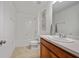 Clean bathroom featuring a tub with shower, toilet, vanity with white countertop, and neutral tile flooring at 1230 Sand Torch Cir, Davenport, FL 33837