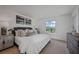 Light-filled bedroom with neutral tones, stylish furnishings, and a cozy atmosphere at 1230 Sand Torch Cir, Davenport, FL 33837