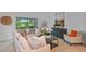 Comfortable living room with neutral tones and sliding glass doors to the outside at 1230 Sand Torch Cir, Davenport, FL 33837