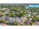 Beautiful aerial view of homes surrounded by lush greenery, with a lake in the background at 1251 Arlington Pl, Winter Park, FL 32789