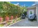 Outdoor space with a wood deck, comfortable seating, vibrant plants, and a tall bamboo screen at 1251 Arlington Pl, Winter Park, FL 32789