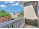 Charming balcony view of the neighborhood, showcasing the architectural details and lush landscaping at 1251 Arlington Pl, Winter Park, FL 32789
