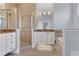 A luxurious bathroom features granite counters, a walk-in shower, and a soaking tub at 1251 Arlington Pl, Winter Park, FL 32789
