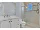 Bright bathroom features white cabinets, granite counters, and a glass shower at 1251 Arlington Pl, Winter Park, FL 32789