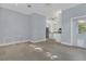 Versatile bonus room featuring tile floors, neutral walls, and easy access to both the kitchen and backyard at 1251 Arlington Pl, Winter Park, FL 32789