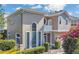 Beautiful exterior elevation featuring arched windows and a private balcony that enhances the home's curb appeal at 1251 Arlington Pl, Winter Park, FL 32789