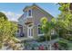 Exterior rear view of a home with a wood deck and landscaped garden at 1251 Arlington Pl, Winter Park, FL 32789