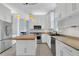 Modern kitchen featuring granite countertops, stainless steel appliances, and a center island with pendant lighting at 1251 Arlington Pl, Winter Park, FL 32789