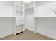 Walk-in closet has custom shelving, drawers and hanging areas for optimal storage at 1251 Arlington Pl, Winter Park, FL 32789