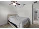 A simple bedroom with a full size bed and ceiling fan at 1328 Pompay Dr, Davenport, FL 33896
