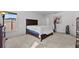 This bedroom has a large window, dresser, and artwork at 1328 Pompay Dr, Davenport, FL 33896