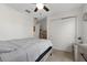 Bright bedroom features a ceiling fan, a closet with sliding doors, and a neutral color scheme at 1328 Pompay Dr, Davenport, FL 33896