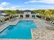 Stunning community pool view with plenty of seating and a covered pavilion area for residents at 1328 Pompay Dr, Davenport, FL 33896