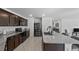This updated kitchen features granite countertops and modern stainless steel appliances at 1328 Pompay Dr, Davenport, FL 33896