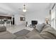 Spacious living room with neutral colors, open to the kitchen, and complete with ample natural light at 1328 Pompay Dr, Davenport, FL 33896
