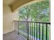 Balcony with a beautiful view of the neighborhood trees at 1342 Benevolent St, Maitland, FL 32751