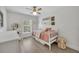 bedroom featuring light-colored wood floors and decorated walls at 1342 Benevolent St, Maitland, FL 32751
