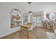 Dining area with view of kitchen, modern lighting, and seamless flow into kitchen at 1342 Benevolent St, Maitland, FL 32751